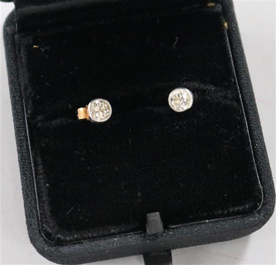 A pair of solitaire diamond ears studs.